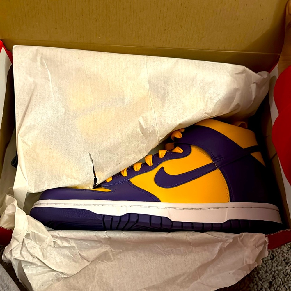 A Nike Hightop Dunk sneaker with a 2 color way size 7 in grade school.